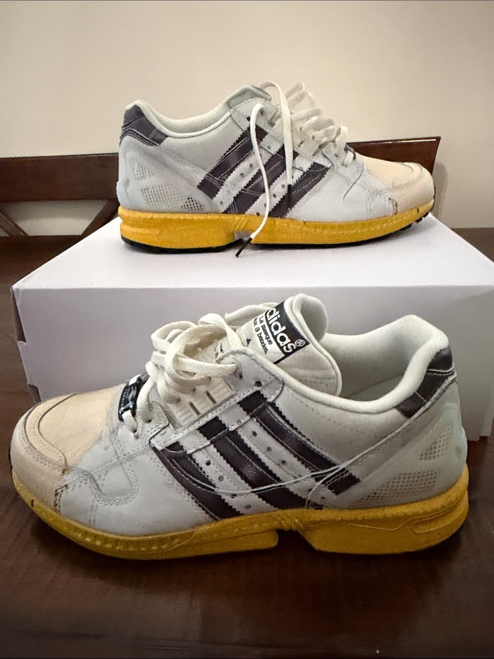 adidas White Sneakers with Yellow Midsoles and Black Stripes